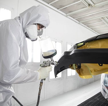 Collision Center Technician Painting a Vehicle | Toyota of Montgomery in Montgomery AL